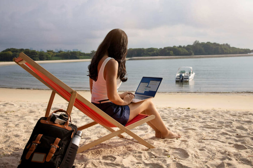 freelancer working from beach